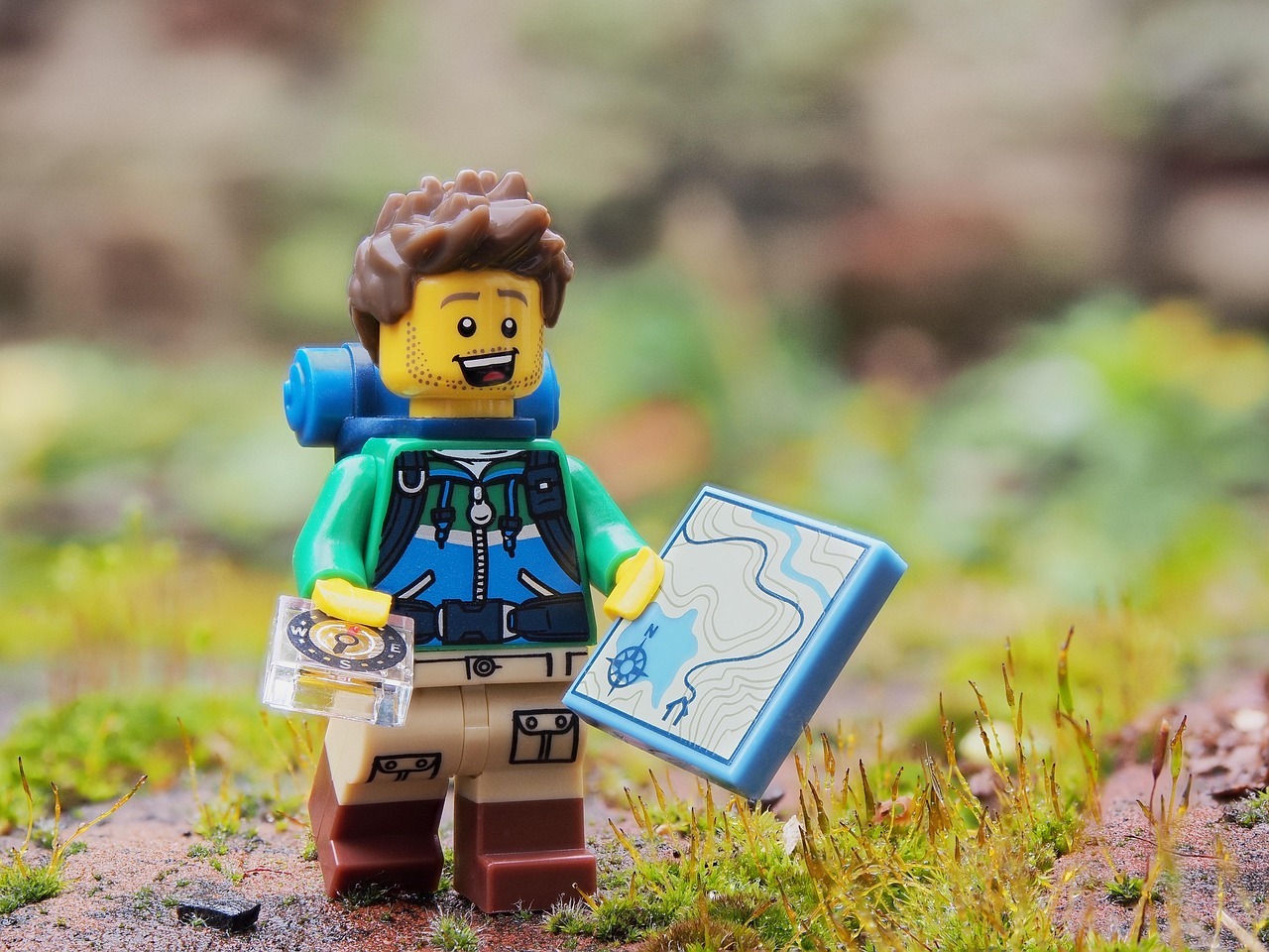 LEGO man hiker with hiking gear and map in hand