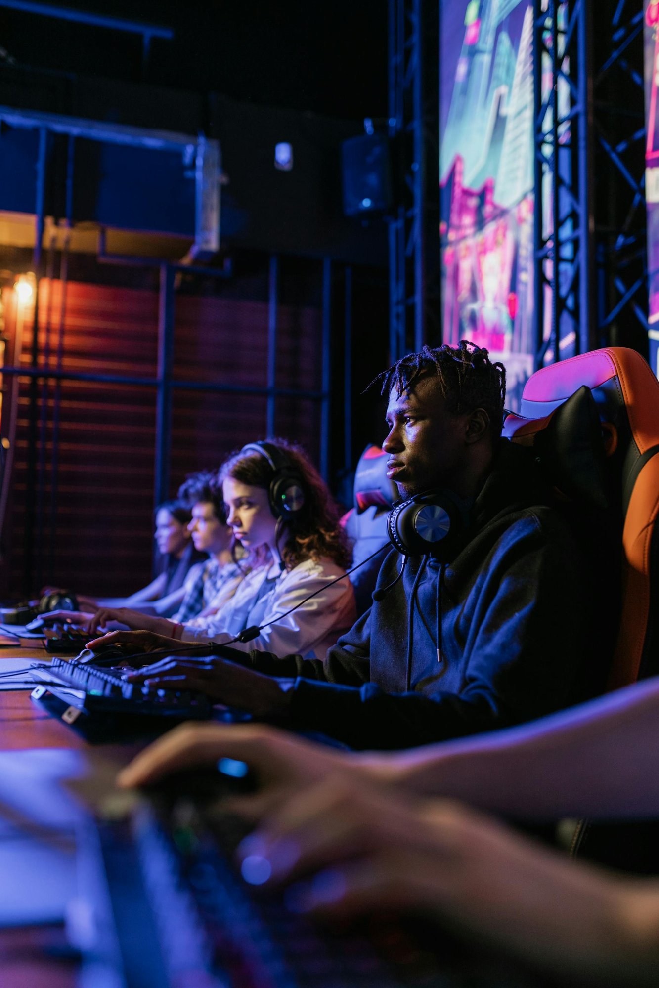 Man in Black Jacket Playing Computer Games