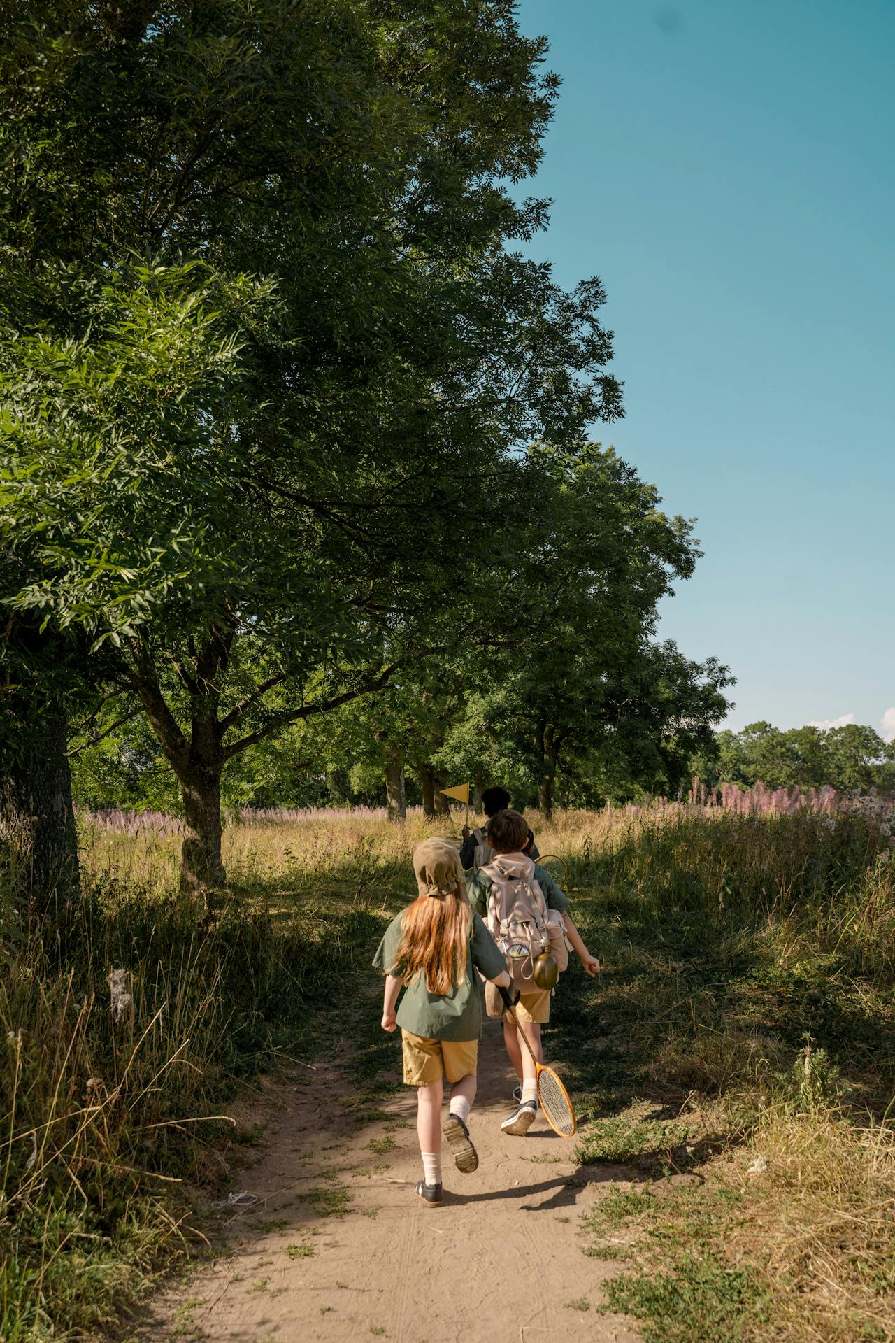 Group of children walking on a pathway. Group of children walking on a pathway.