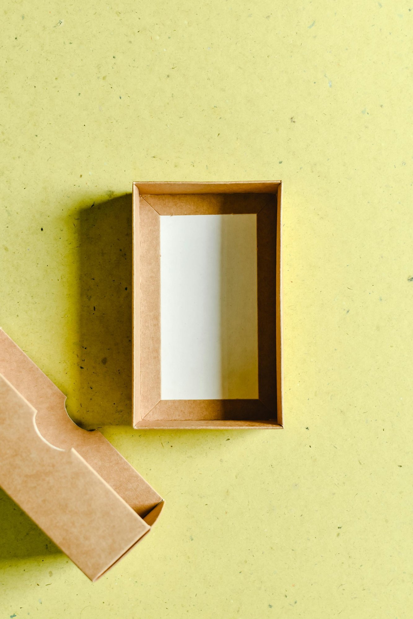 Photo of a Brown Box on a Yellow Surface