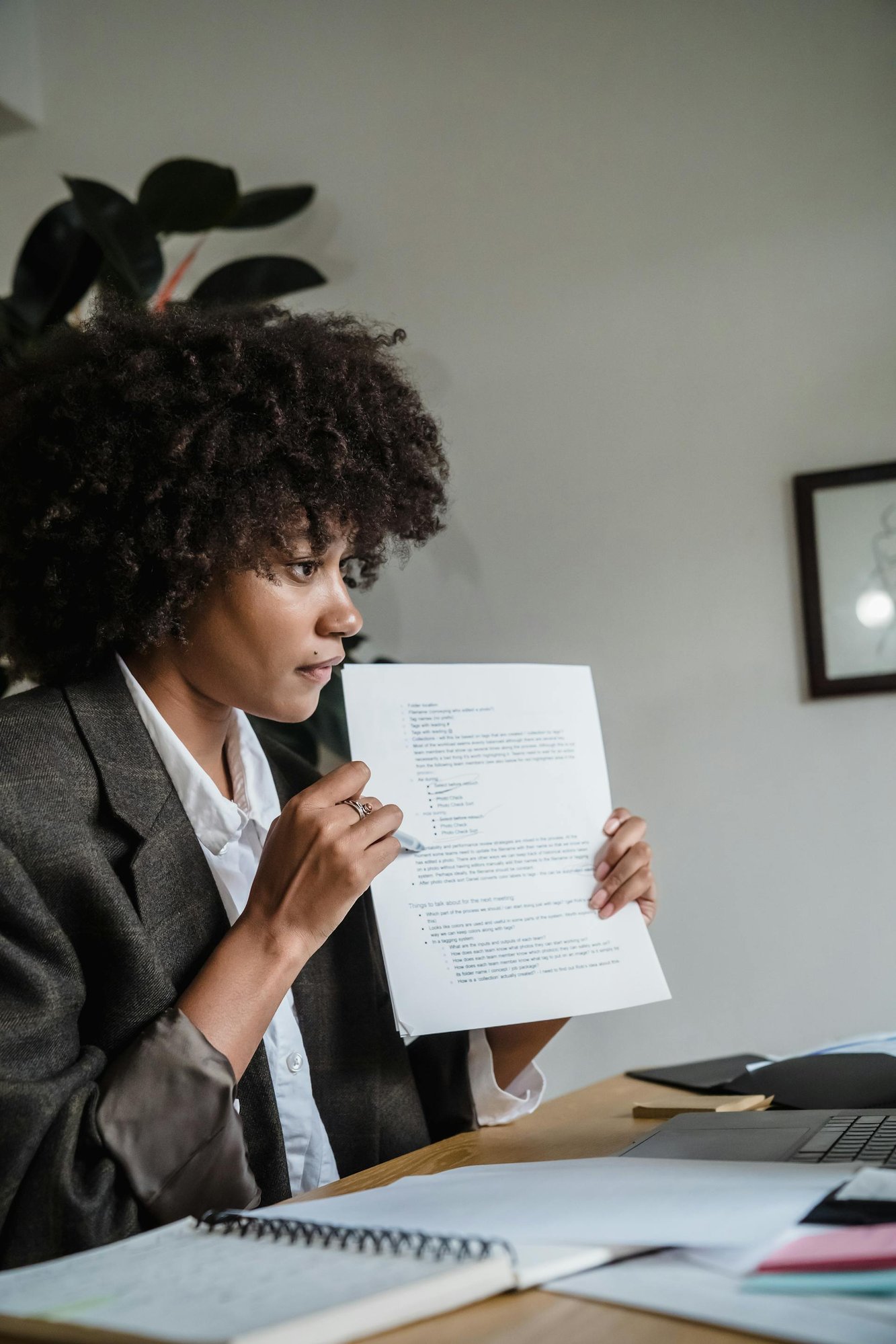 Woman showing documents at work